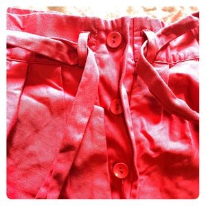 ELOQUII coral button & tie midi skirt.